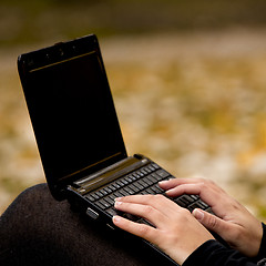 Image showing Working on a laptop