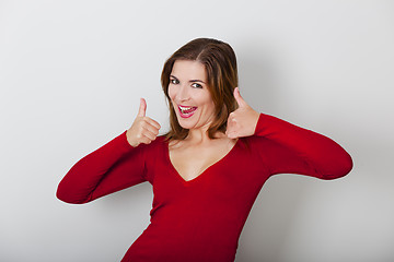Image showing Happy woman with thumbs up