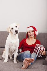 Image showing Woman with her dog on Christmas Day