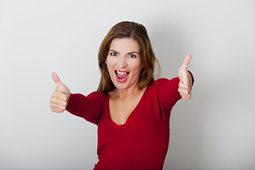 Image showing Happy woman with thumbs up