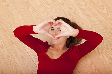 Image showing Woman lying on the floor