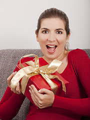 Image showing Opening a christmas present