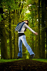 Image showing Girl jumping in the nature