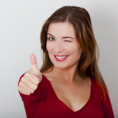 Image showing Happy woman with thumbs up