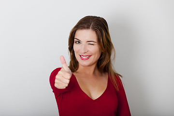 Image showing Happy woman with thumbs up