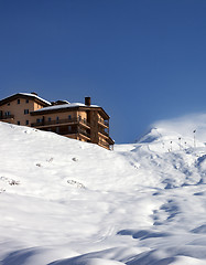 Image showing Off-piste slope and hotel at sun day