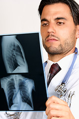 Image showing Doctor examining x-rays