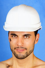 Image showing Dirty manual worker with hard hat