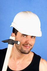Image showing Handsome worker with hard hat and hammer