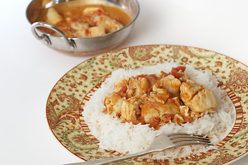 Image showing Fish curry and serving bowl horizontal