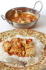 Image showing Fish curry meal and kadai bowl vertical