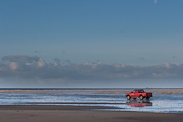 Image showing Red car on the beach Island of Fanoe in Denmark