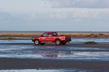 Image showing Red car on the beach Island of Fanoe in Denmark