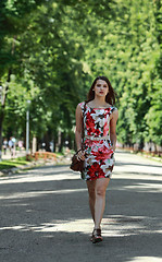 Image showing Young Woman Walking in a Park