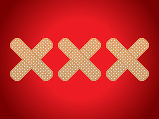 Image showing XXX shaped plasters on red background