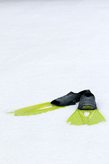 Image showing Flippers lying on the snow, conceptual photo
