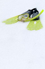 Image showing Snorkel, mask and flippers on the snow