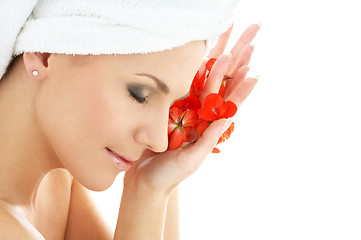 Image showing happy woman with red flower petals