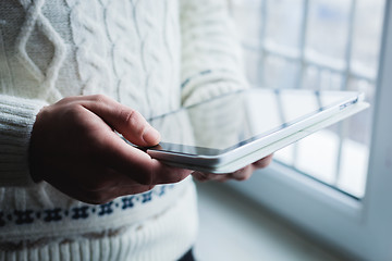 Image showing The man is using a smartphone. Modern mobile phone in hand.