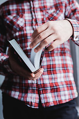 Image showing Man reading. Book in his hands.