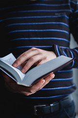 Image showing Man reading. Book in his hands.