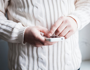 Image showing The man is using a smartphone. Modern mobile phone in hand.