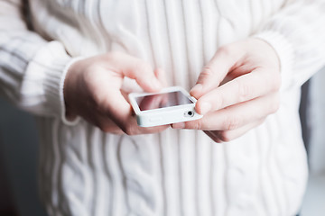 Image showing The man is using a smartphone. Modern mobile phone in hand.