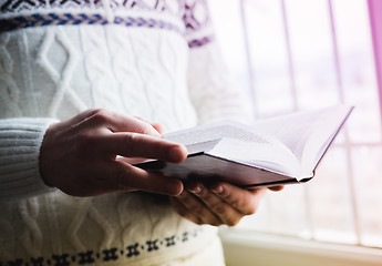 Image showing Man reading. Book in his hands.