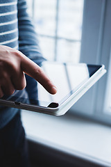 Image showing The man uses a tablet PC. Modern gadget in hand.