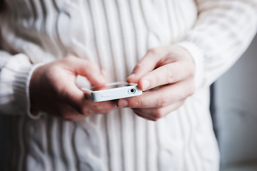 Image showing The man is using a smartphone. Modern mobile phone in hand.