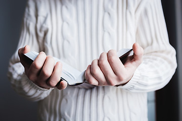 Image showing Man reading. Book in his hands.