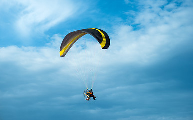 Image showing Paragliding fly on blue sky