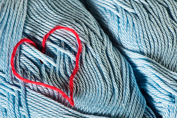 Image showing Knitted red heart on blue