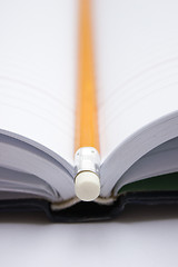 Image showing Pencil on a book