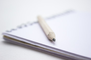 Image showing Pencil on a book