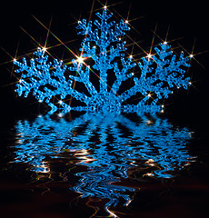 Image showing twinkling blue snowflake