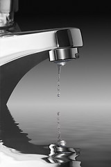 Image showing dripping faucet over water surface