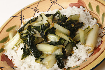 Image showing Sauteed bok choi on a bed of jasmine rice