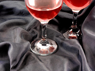 Image showing Red wine in glass on black background close up