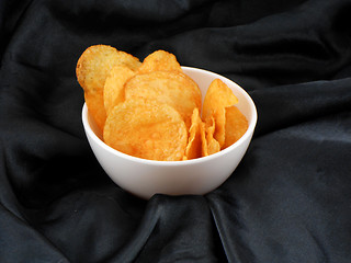 Image showing Chips in a plate on black material background