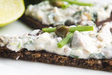 Image showing sandwiches with dark bread, herrings, mushrooms, pepper