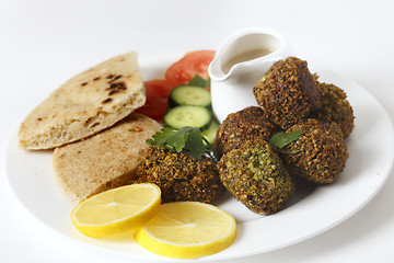 Image showing Plate of falafel with breat and salad