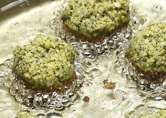 Image showing Falafel balls frying in oil