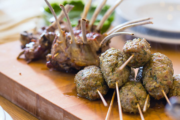 Image showing Roasted lamb meat on the big table