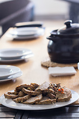 Image showing Roasted meat slices on the table