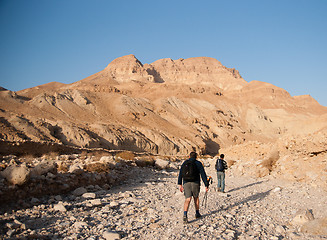 Image showing Tourists hiking in dead sea mountains