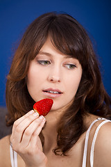 Image showing Eating strawberries