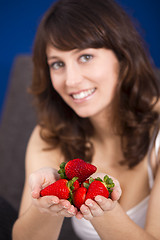 Image showing Eating strawberries