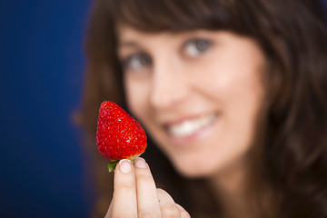 Image showing Eating strawberries