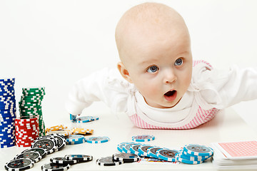 Image showing baby playing with chips